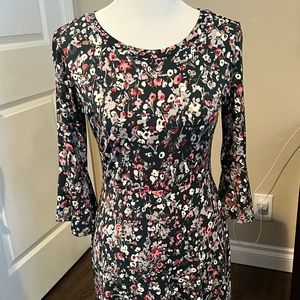 Floral, form-fitting dress.